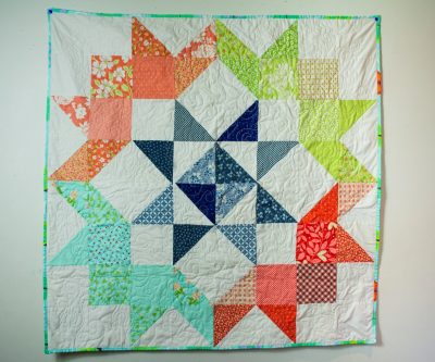 Modern unisex colourful patchwork baby quilt
